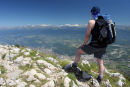 07-2190 Mountaineer on the Summit of Le Moucherotte Above the City of Grenoble Looking East Towards the Alps